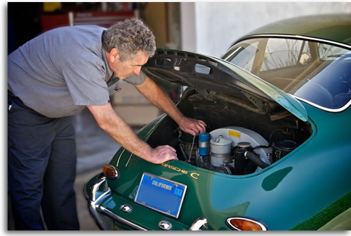Haik inspecting Porsche engine